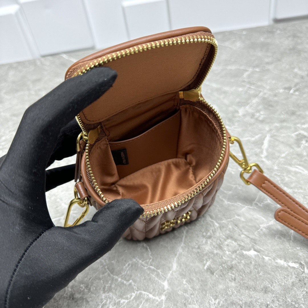 Miu Miu Matelassé Leather Cylinder Vanity Bag