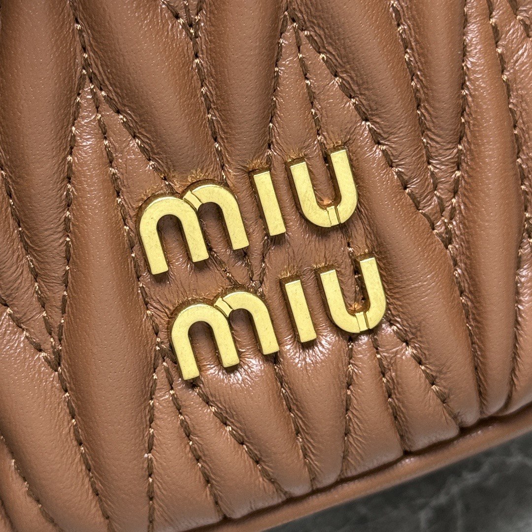 Miu Miu Matelassé Leather Cylinder Vanity Bag